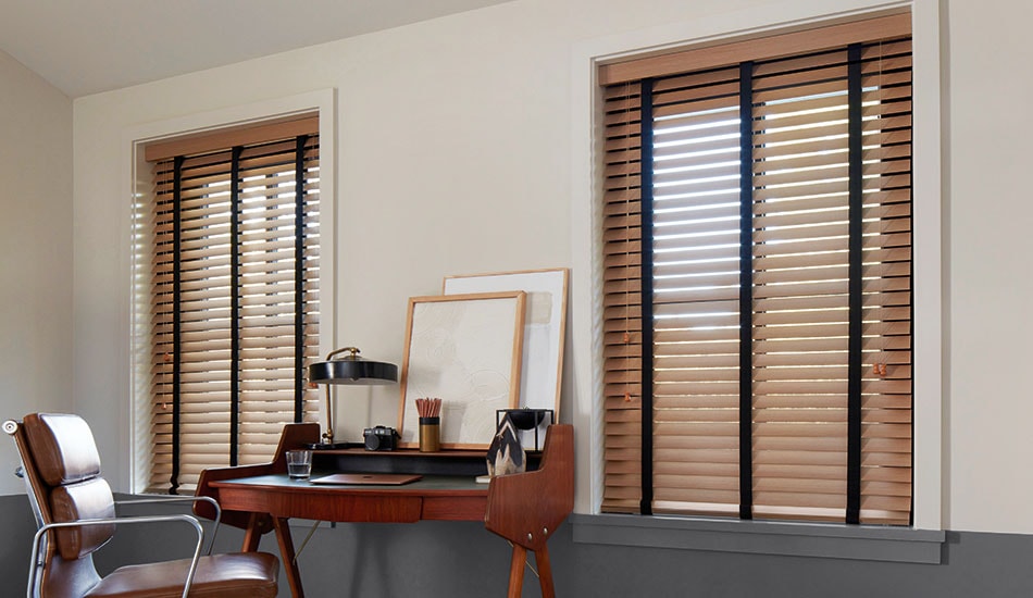Floor-to-ceiling venetian blinds in a contemporary open-plan living space